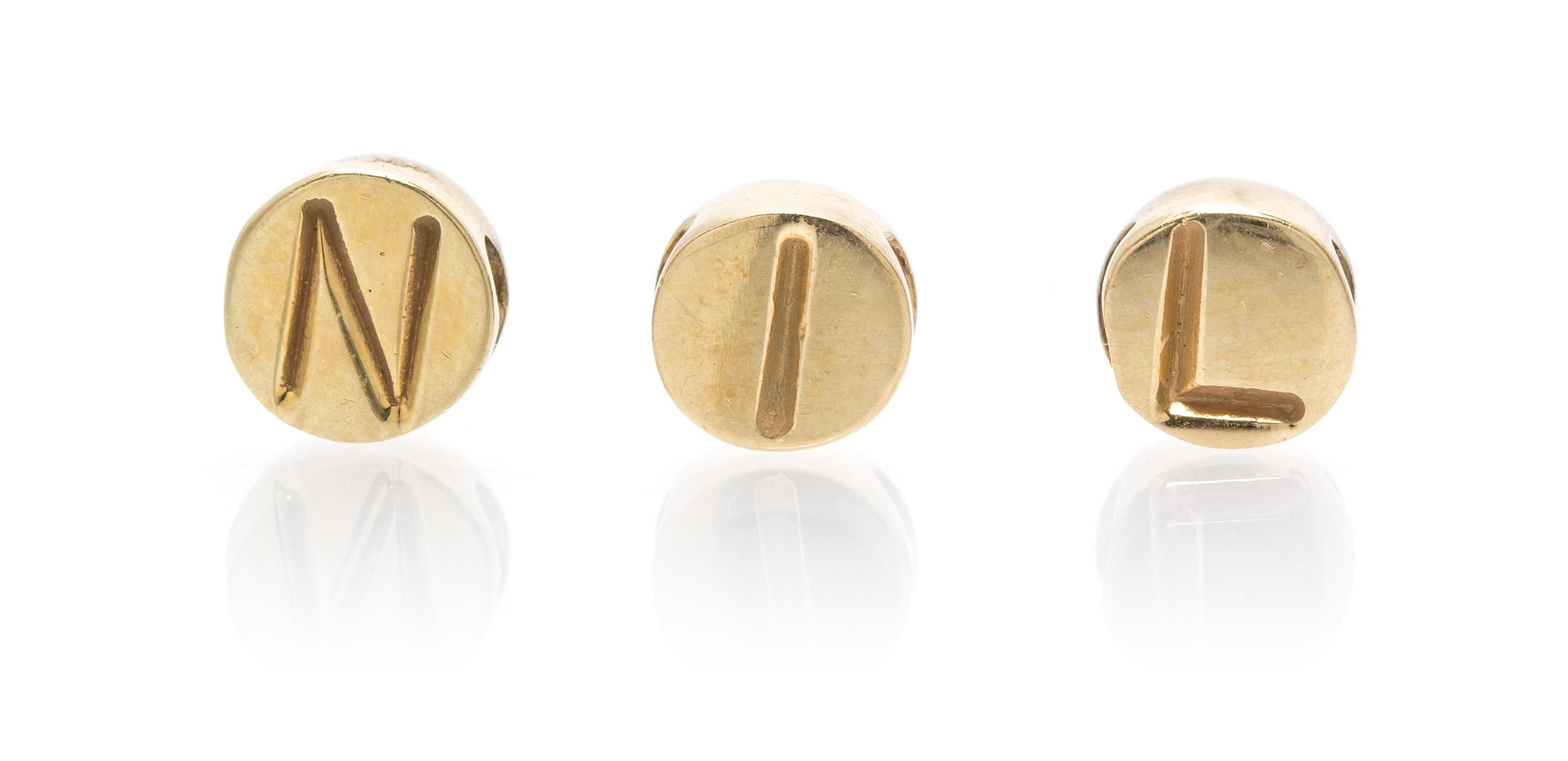 A Collection of 14 Karat Yellow Gold Letter Beads, 2.50 dwts.