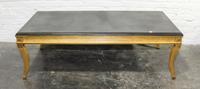 A Regency Style Giltwood Low Table. Height 17 x width 53 1/2 x depth 27 3/4 inches.