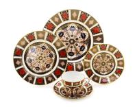 A Royal Crown Derby Porcelain Dinner Service for Twelve, Diameter of first 10 1/2 inches.