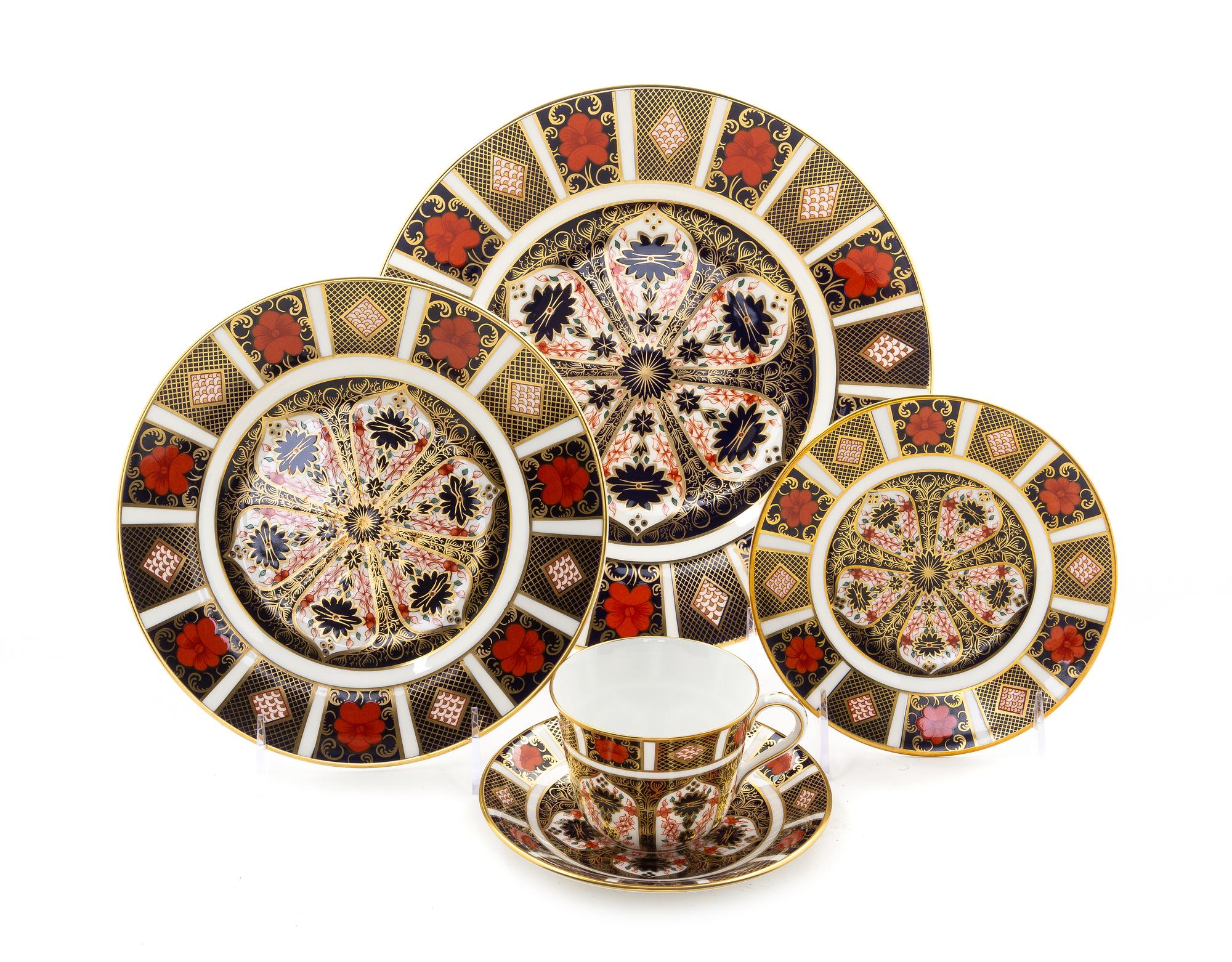 A Royal Crown Derby Porcelain Dinner Service for Twelve, Diameter of first 10 1/2 inches.