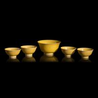 A Group of Five Chinese Incised Yellow Glazed Porcelain "Dragon" Bowls, 19th/20th Century — 清晚期 黃釉暗刻龍紋碗一組五件