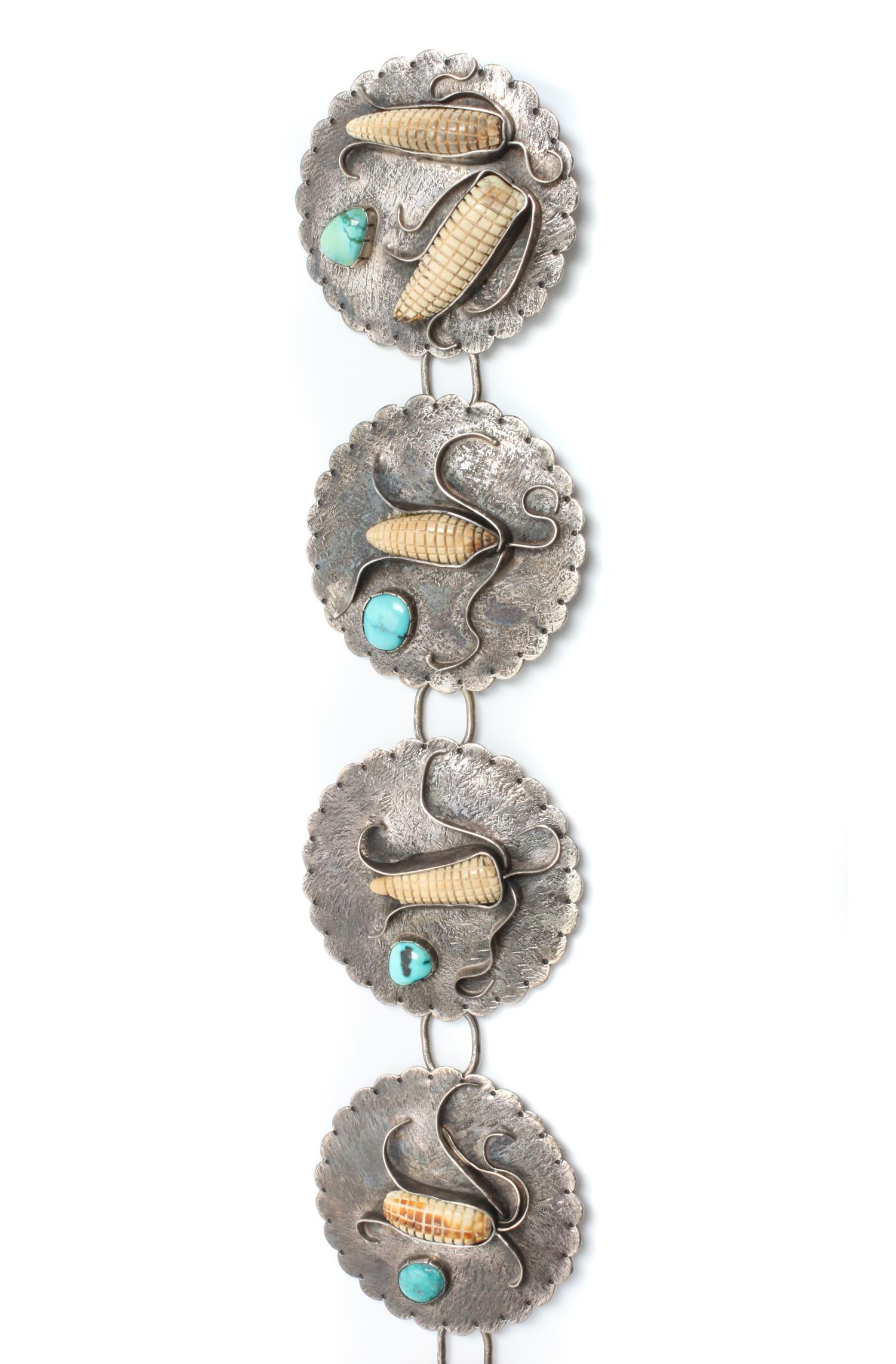 A Southwestern Silver and Turquoise Bracelet and Concho Belt, Buddy Lee Length 5 x opening 1 x width 2 1/4 inches.