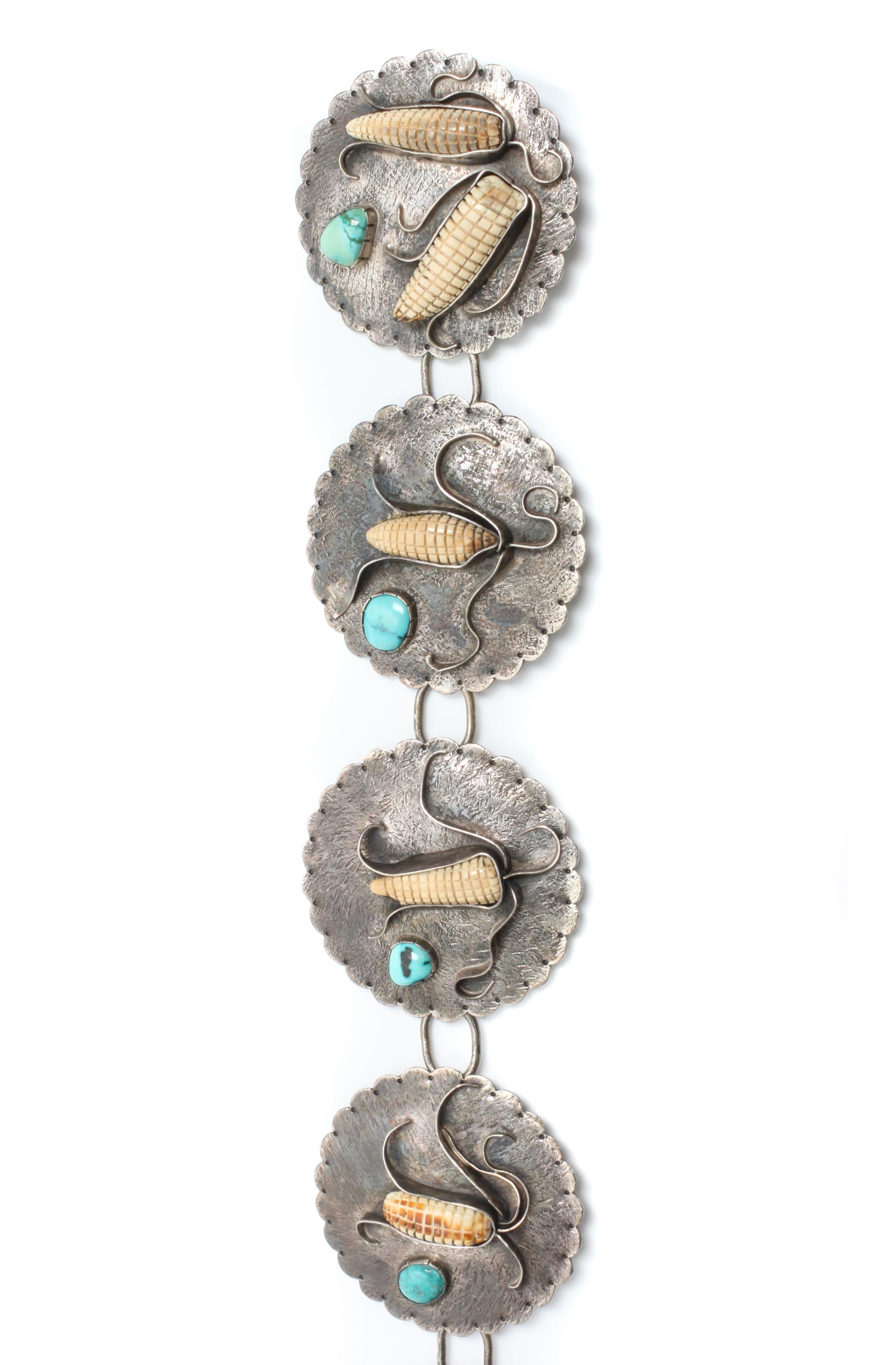 A Southwestern Silver and Turquoise Bracelet and Concho Belt, Buddy Lee Length 5 x opening 1 x width 2 1/4 inches.