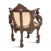An Italian Carved Walnut Corner Chair