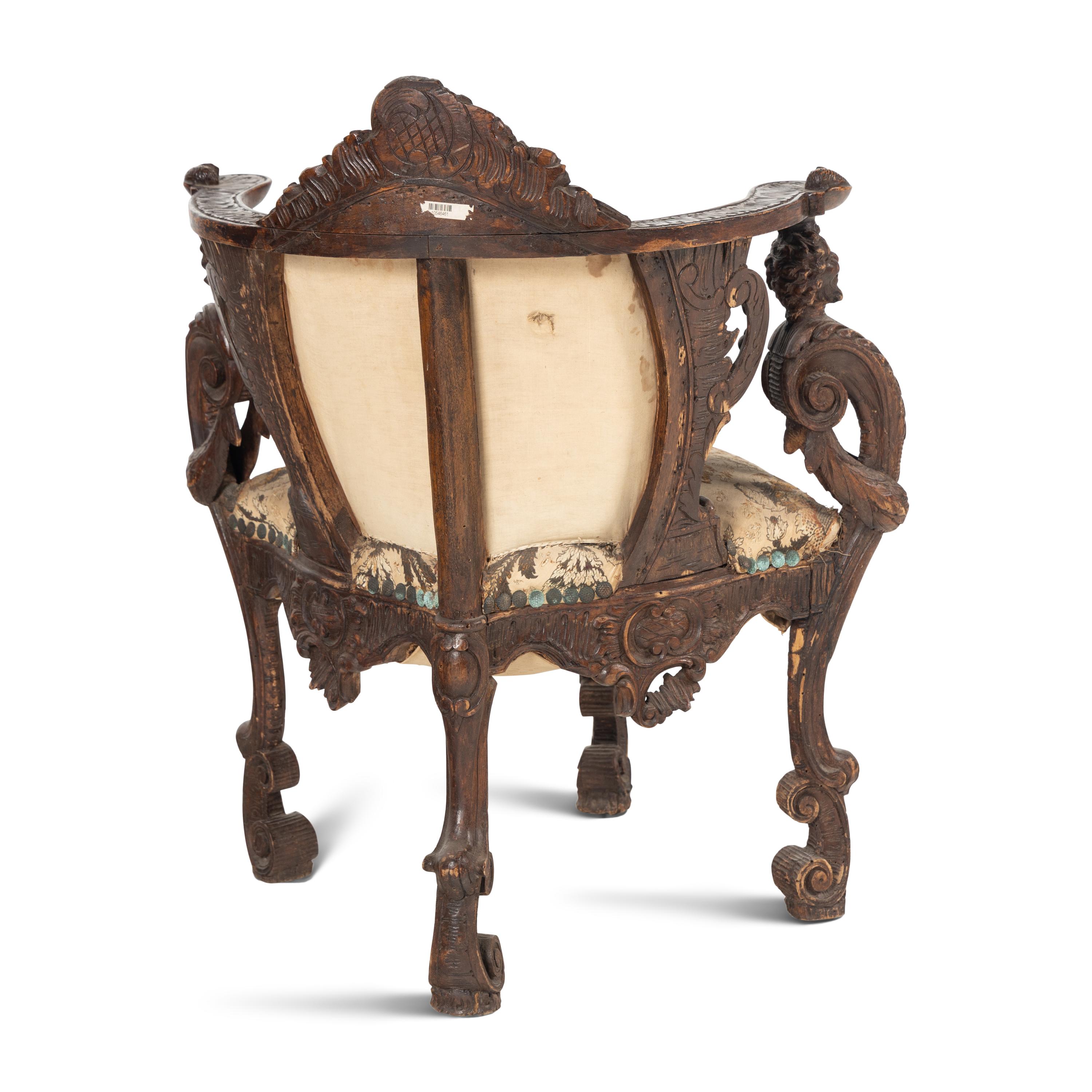 An Italian Carved Walnut Corner Chair