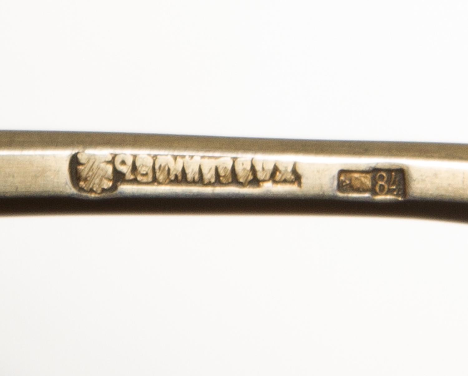 A Russian Silver-Gilt and Enamel Spoon, Mark of I.P. Khlebnikov with Imperial warrant, Moscow, late 19th century, having a green and re