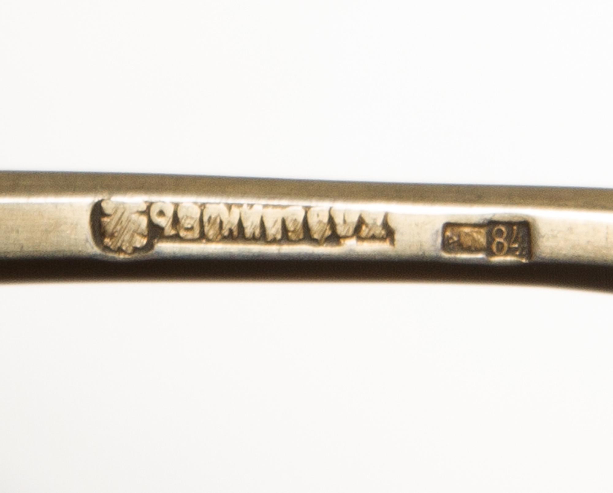 A Russian Silver-Gilt and Enamel Spoon, Mark of I.P. Khlebnikov with Imperial warrant, Moscow, late 19th century, having a green and re