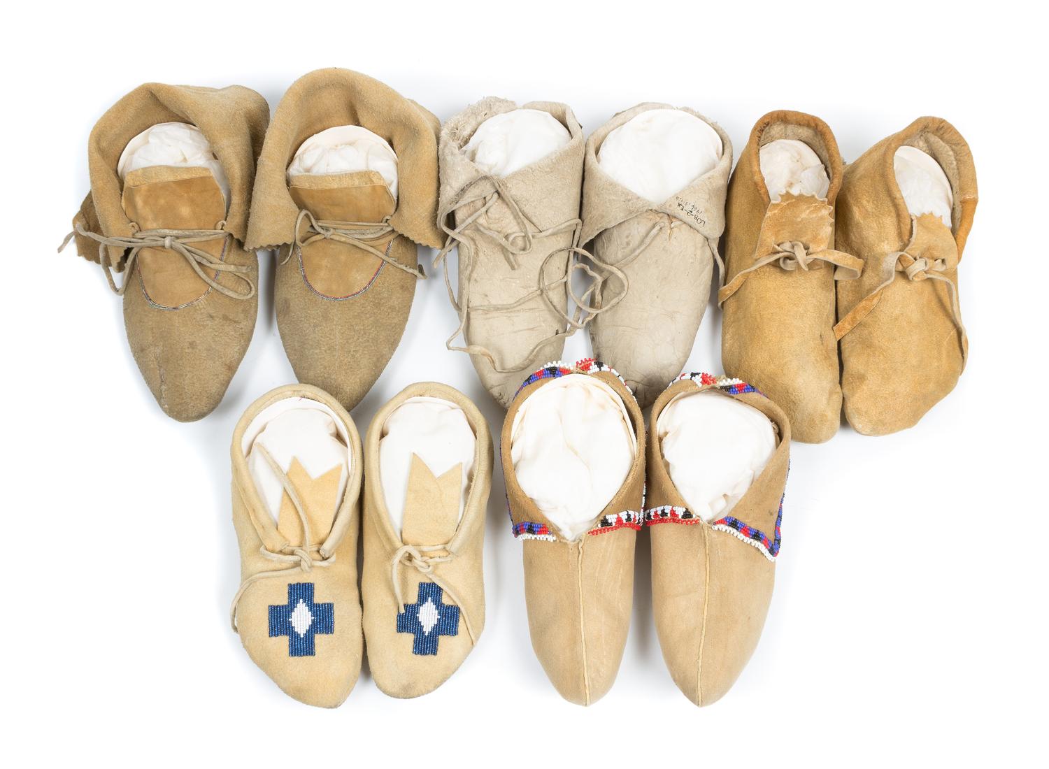 Five Pairs of Soft Soled Moccasins Length of longest 10 inches.