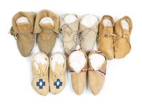 Five Pairs of Soft Soled Moccasins Length of longest 10 inches.