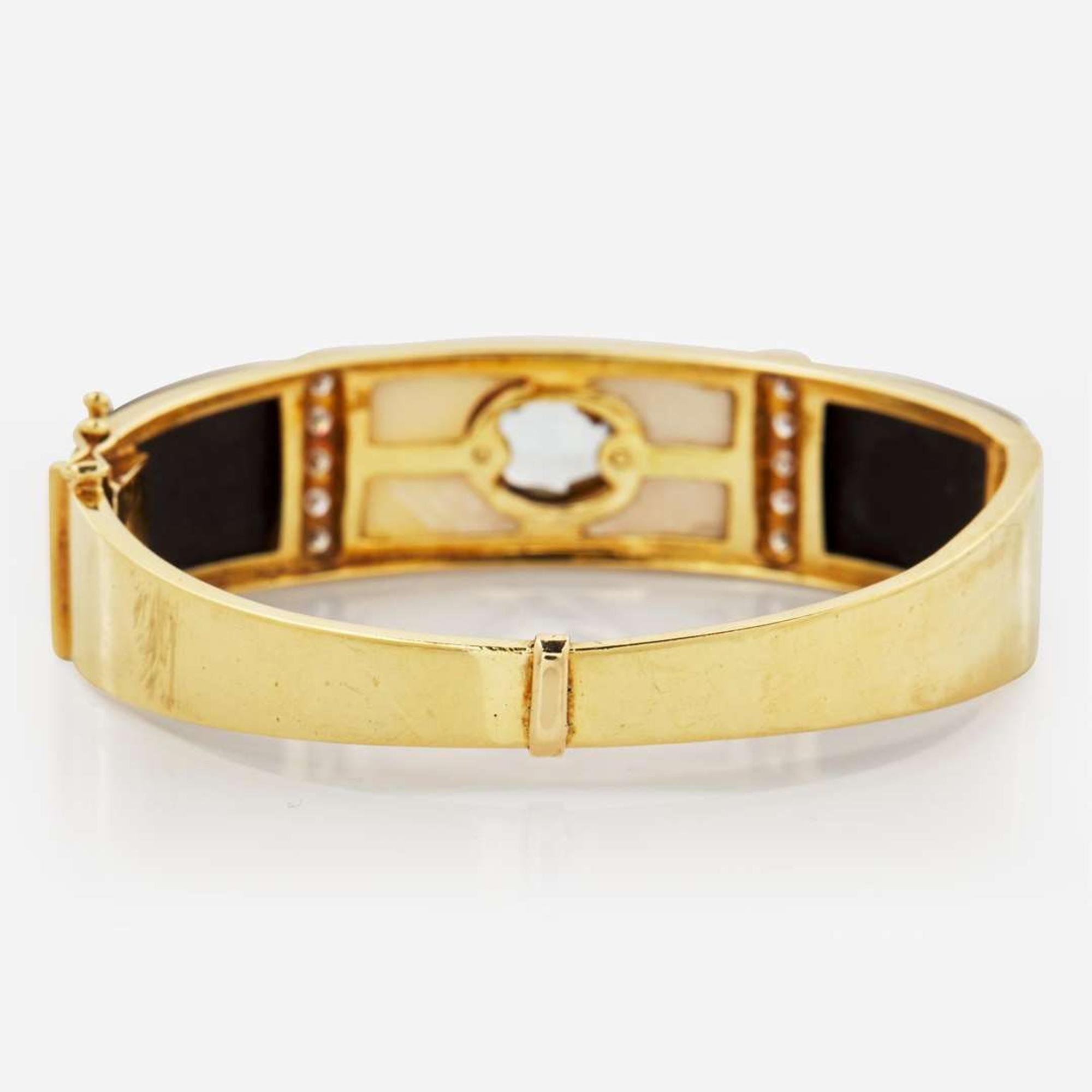 A 14K Yellow Gold and Gemstone Bangle Bracelet