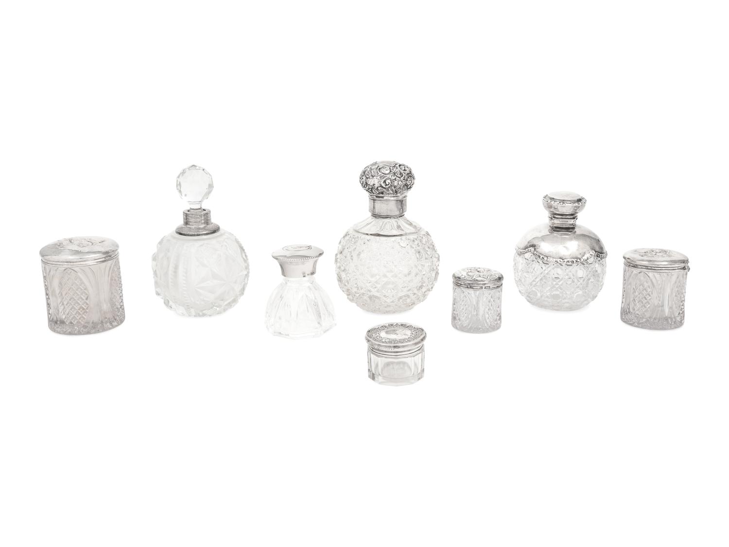 A Collection of Eight Silver Mounted Jars
