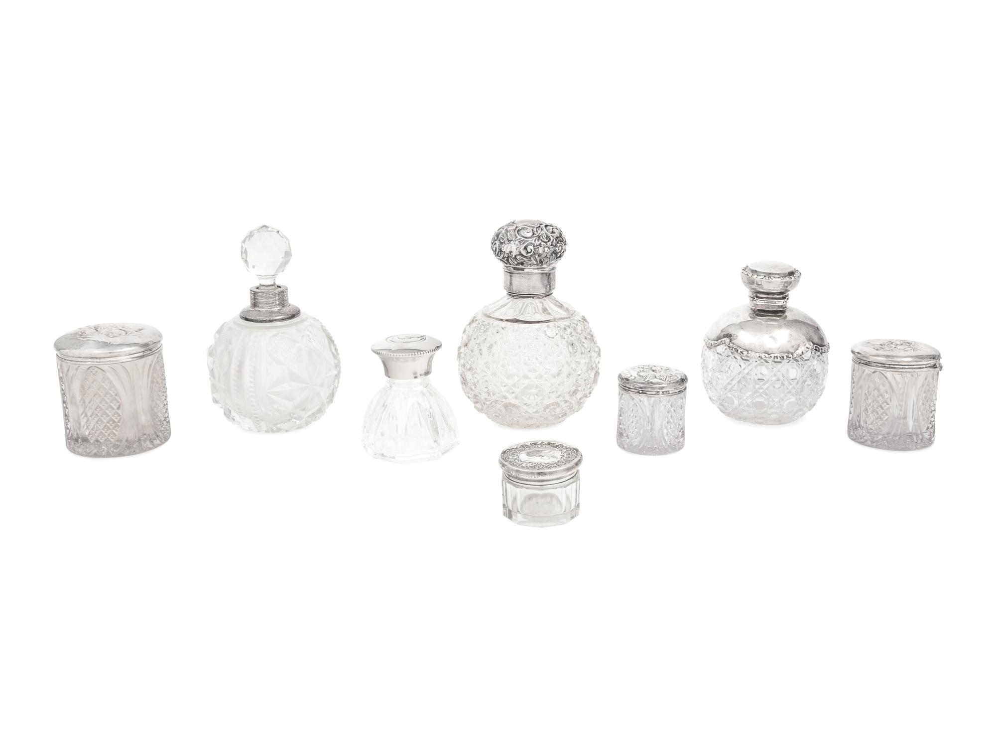 A Collection of Eight Silver Mounted Jars