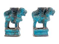 A Pair of Chinese Turquoise Glazed Pottery Fu Lion-Form Candle Holders
