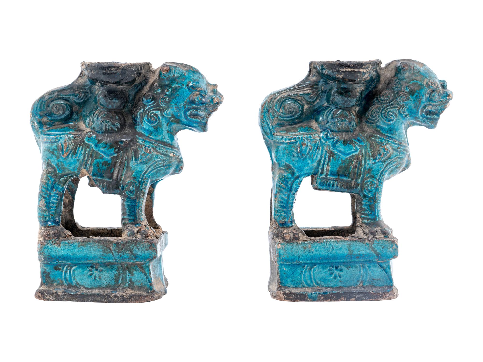 A Pair of Chinese Turquoise Glazed Pottery Fu Lion-Form Candle Holders