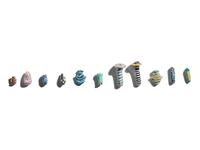 A Group of Eleven Glass Amulets and Ear Studs
