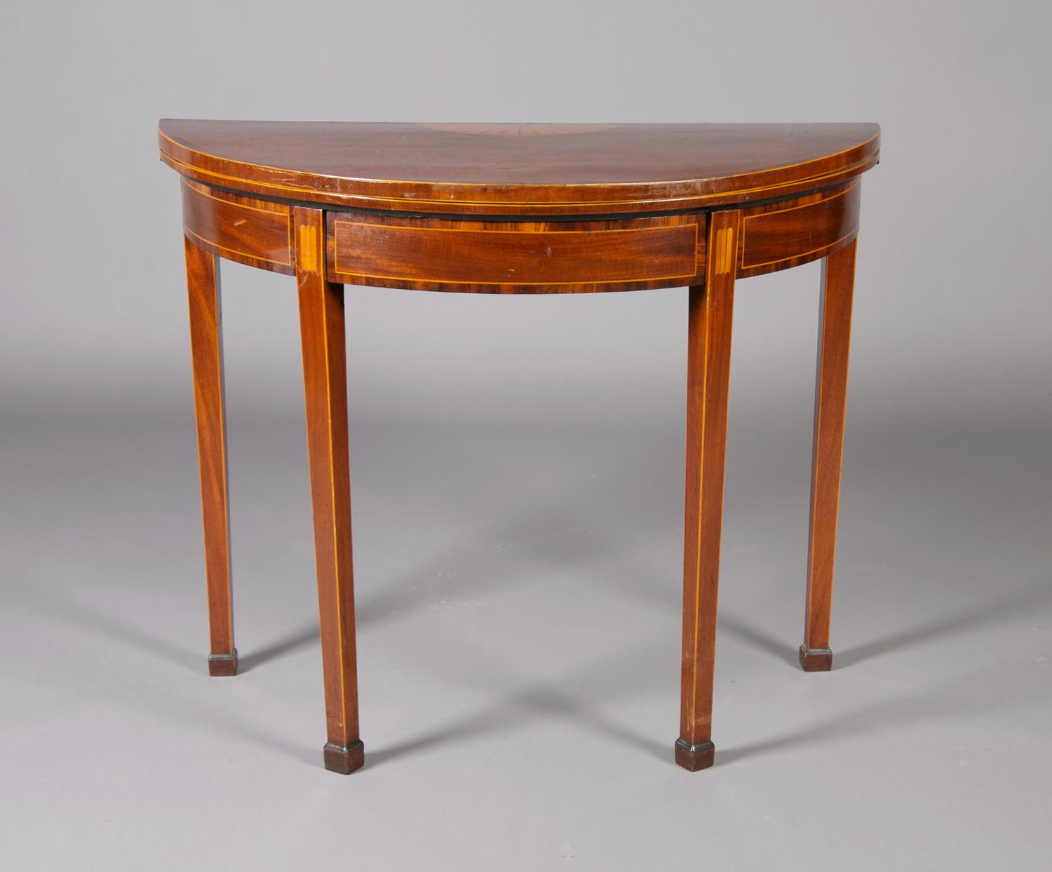 A George III Mahogany and Inlaid Games Table, Height 29 1/8 x width 36 x depth 17 3/4 inches closed.