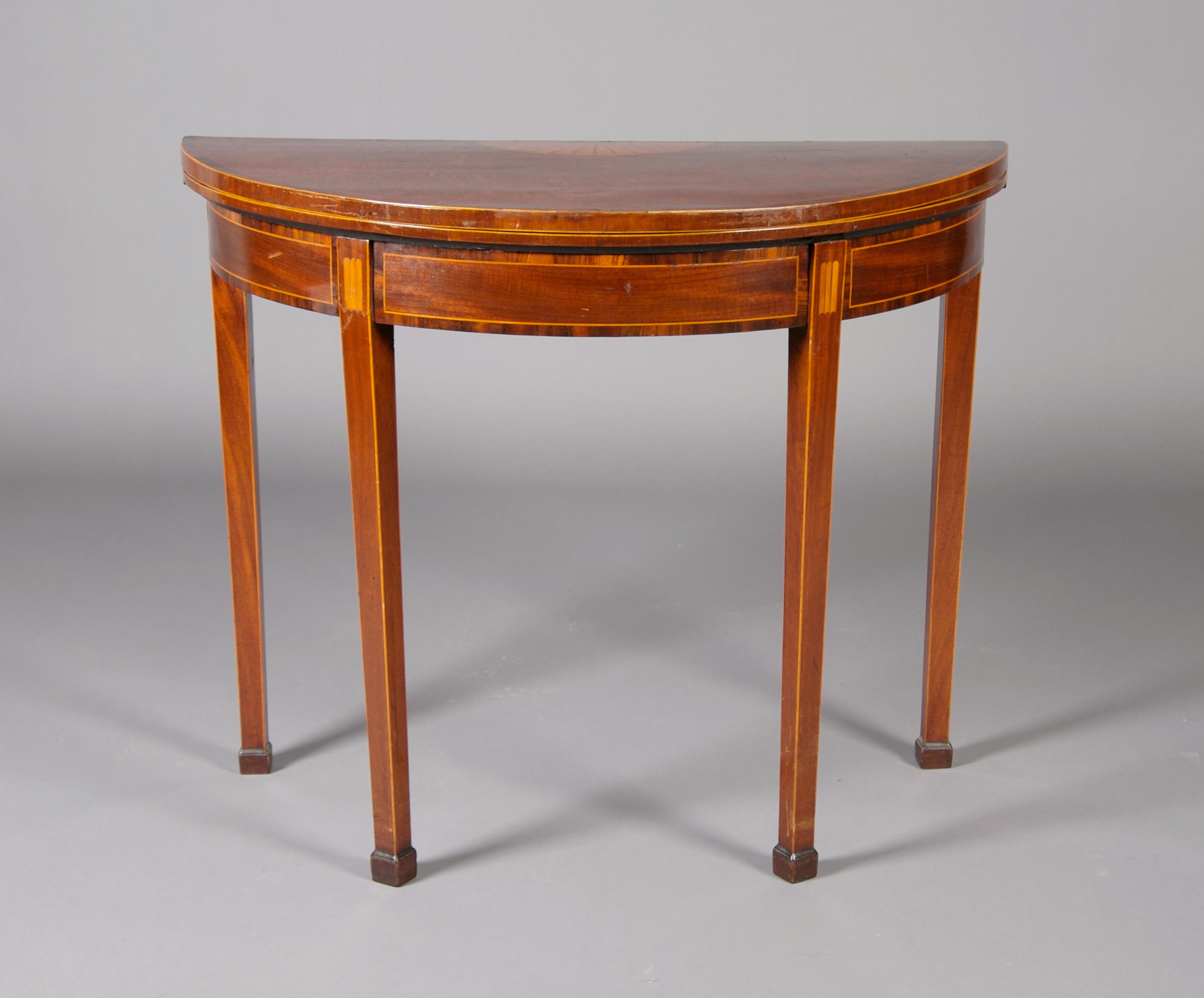 A George III Mahogany and Inlaid Games Table, Height 29 1/8 x width 36 x depth 17 3/4 inches closed.