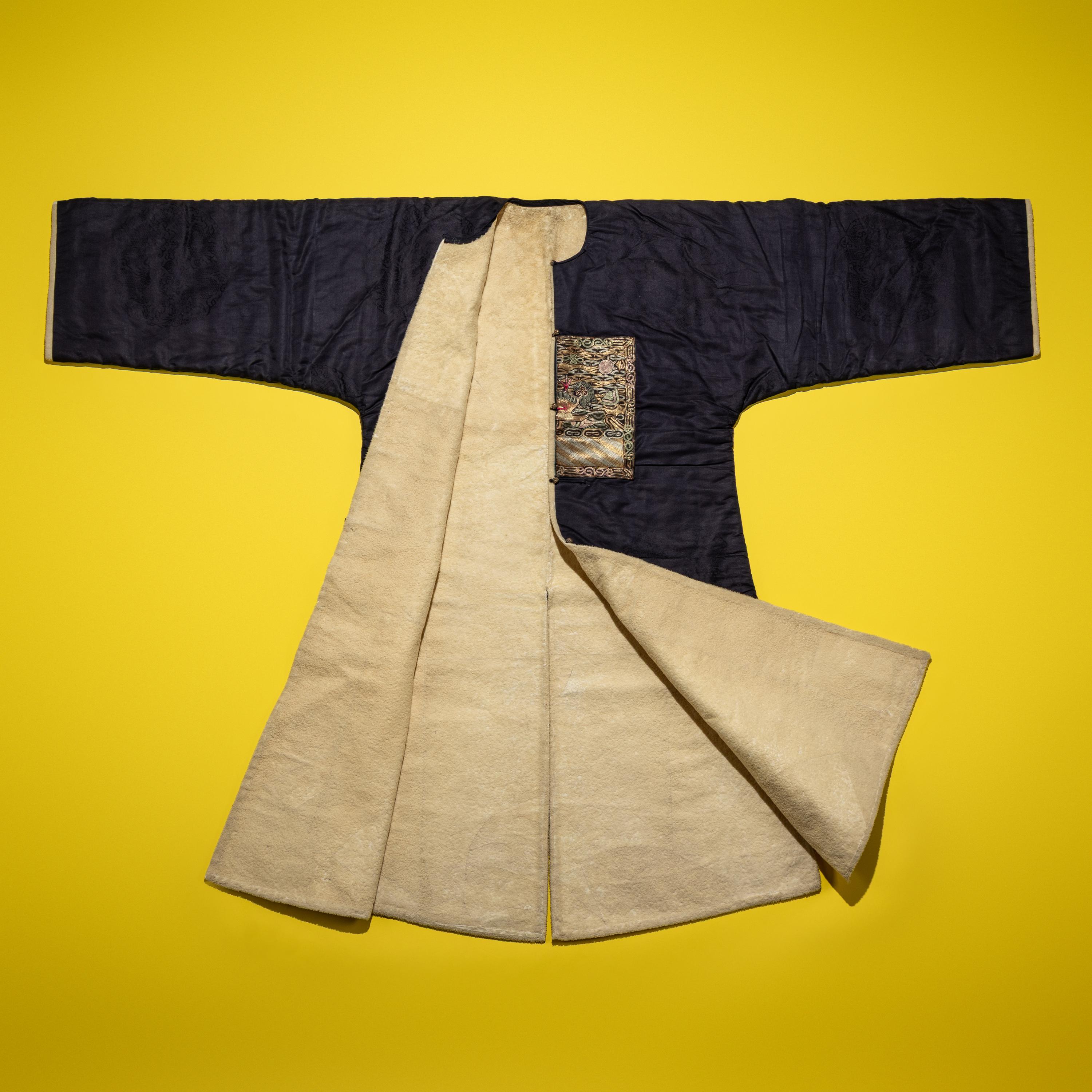 A Chinese Dark Blue Silk Fur Lined Official's Robe, Bufu , Late Qing Dynasty — 清晚期 石青地四品武官冬補服