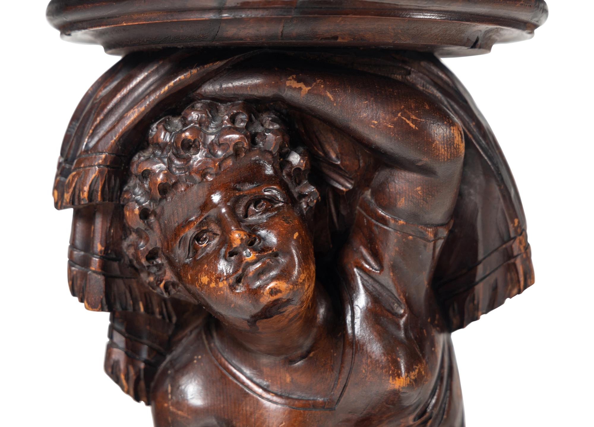 A Venetian Carved Walnut Figural Pedestal