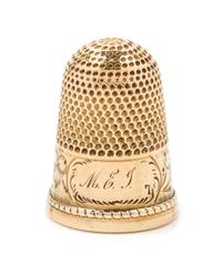 A Yellow Gold Thimble, Possibly American, the knurled top and body above an engraved floral and foliate band bearing an engraved monogr