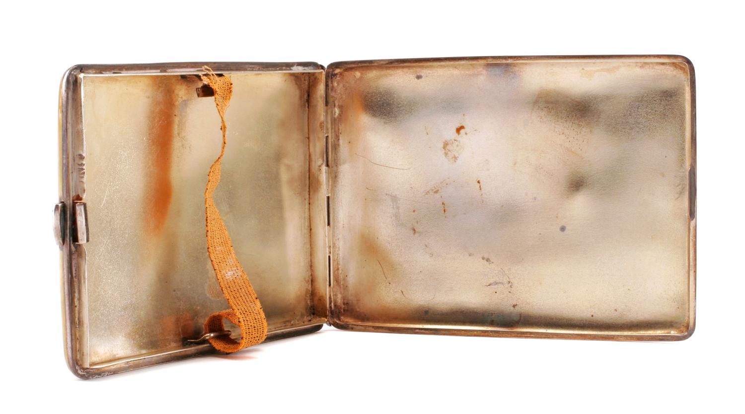 An English Enameled Silver Cigarette Case, Maker's Marks Obscured, the lid enameled to show a nude model.