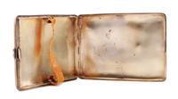 An English Enameled Silver Cigarette Case, Maker's Marks Obscured, the lid enameled to show a nude model.