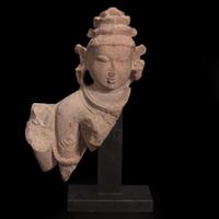 An Indian carved pinkish-buff sandstone bust of a female deity 砂岩雕女神像 Uttar Pradesh, 10th / 11th century ??? ??????