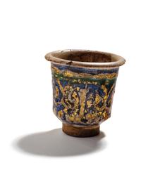 An Islamic Blue, Green and Iridescent Gold Glazed Pottery Cup