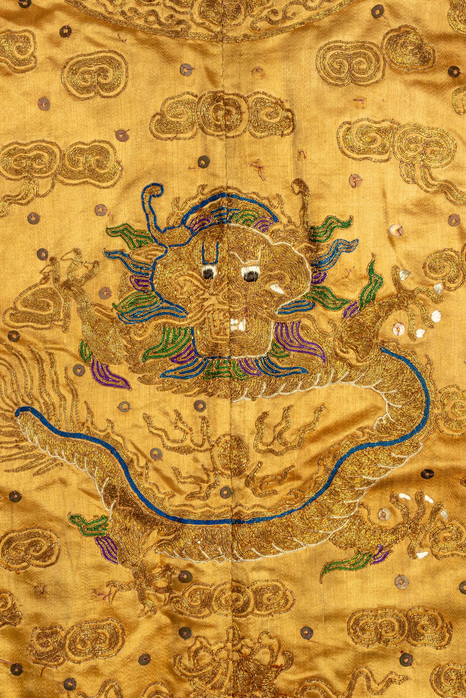 A Chinese Yellow Ground Embroidered Silk Dragon Robe