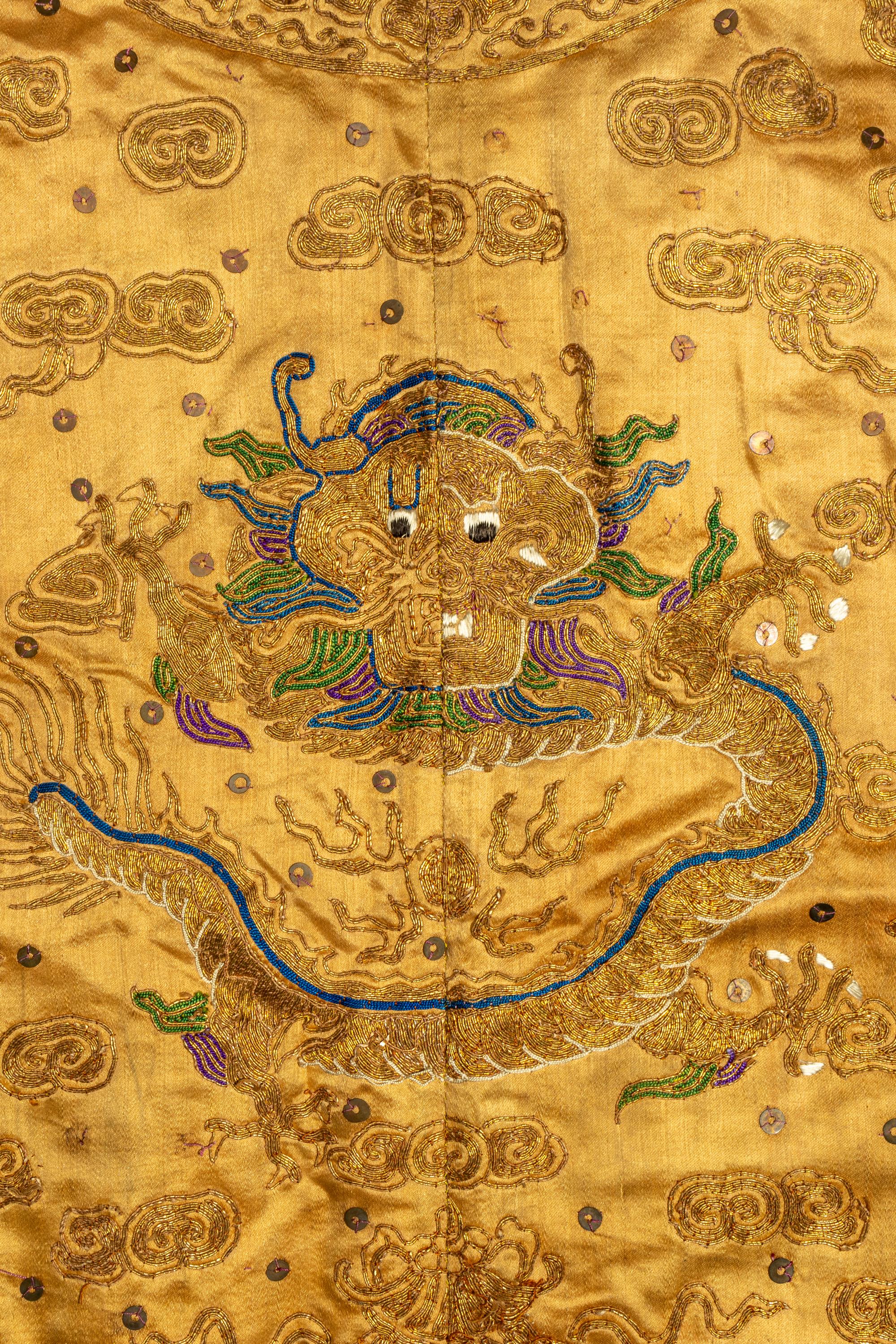 A Chinese Yellow Ground Embroidered Silk Dragon Robe