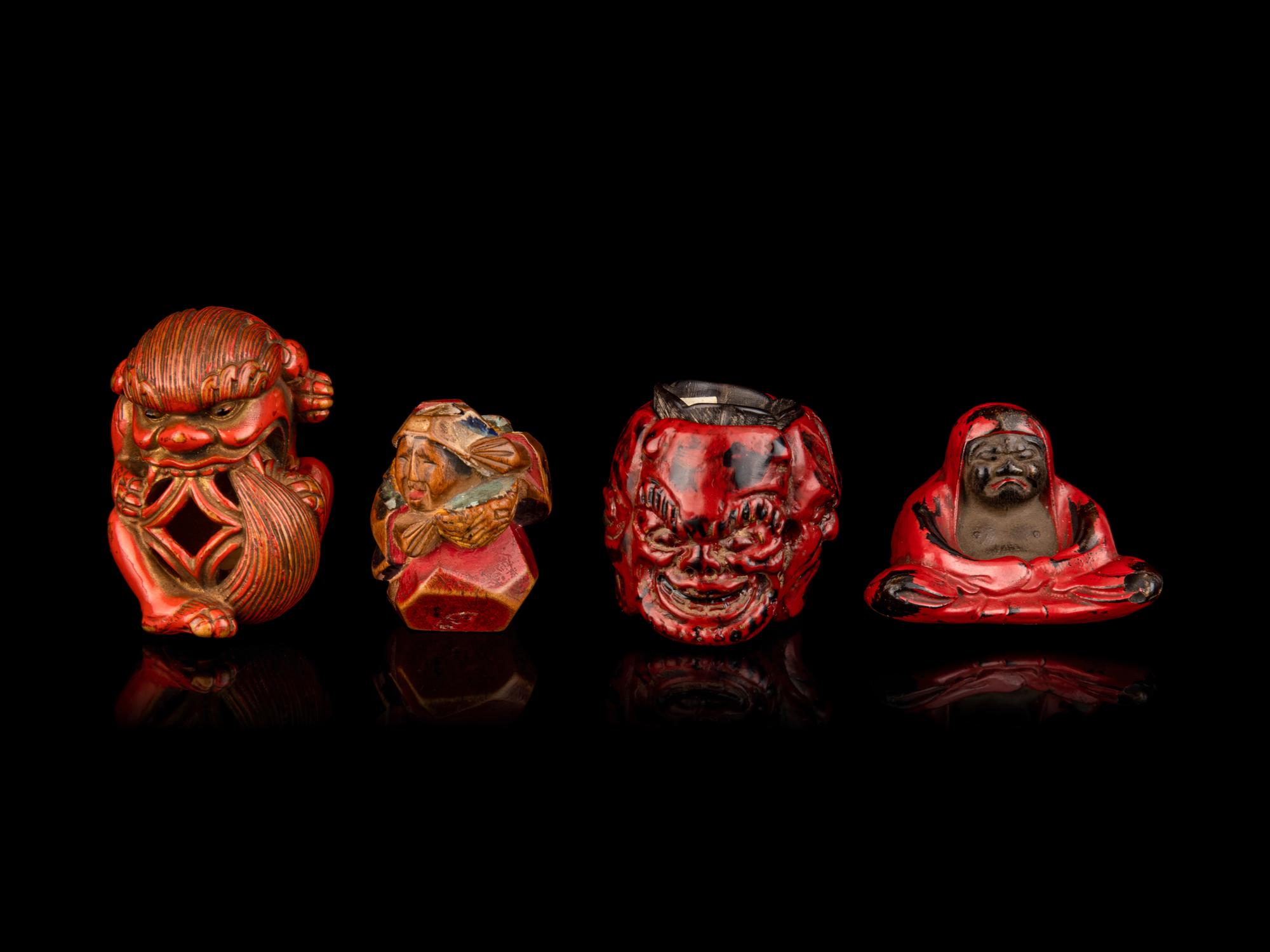 Four Japanese Carved and Red Lacquered Wood Netsuke