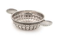 An Italian Silver Wine Taster, Buccellati, Milan, 20th Century, having twin scallop-form handles and a lobed body.