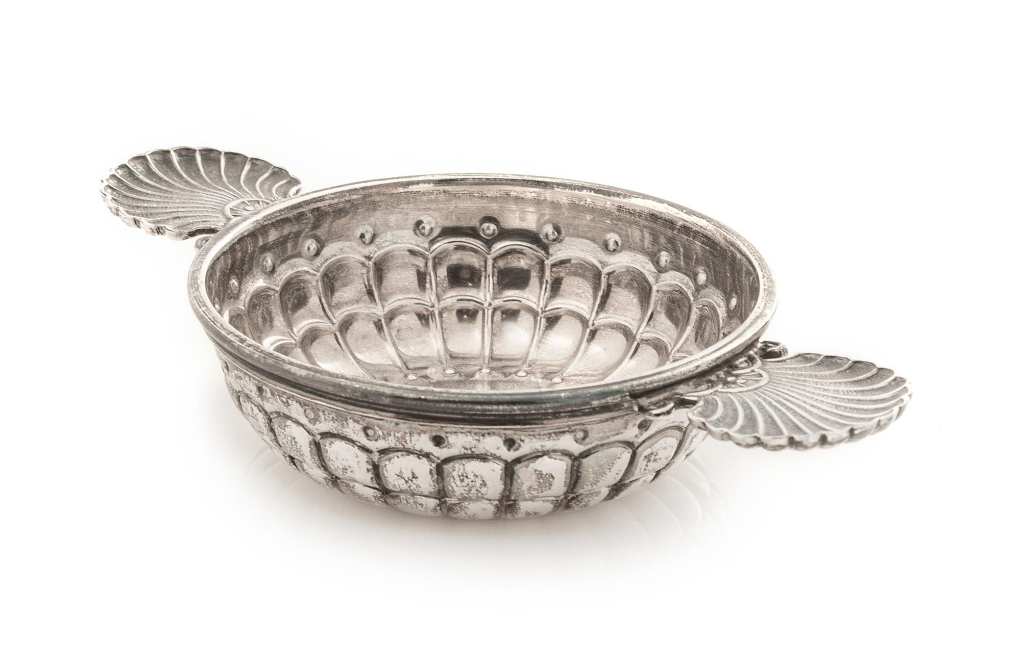 An Italian Silver Wine Taster, Buccellati, Milan, 20th Century, having twin scallop-form handles and a lobed body.