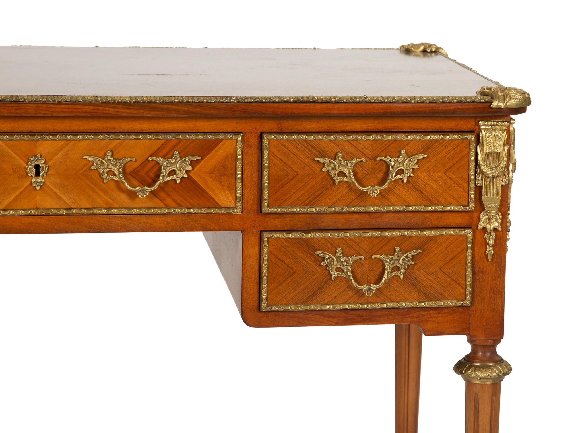 A Louis XVI Style Gilt-Bronze Mounted Mahogany Bureau Plat