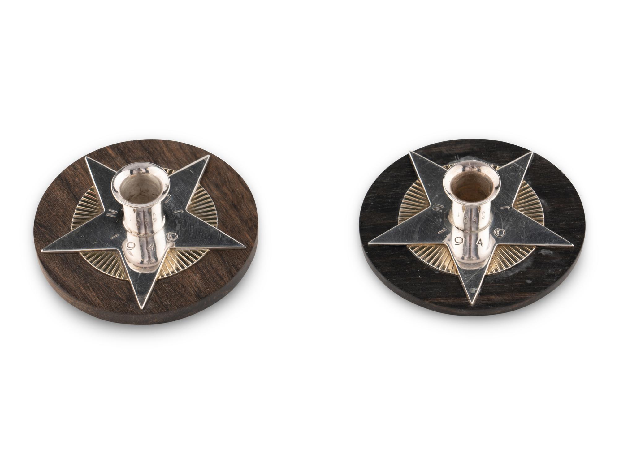 An Associated Pair of Arno Malinowski for Georg Jensen Silver and Ebony Christmas Candle Holders