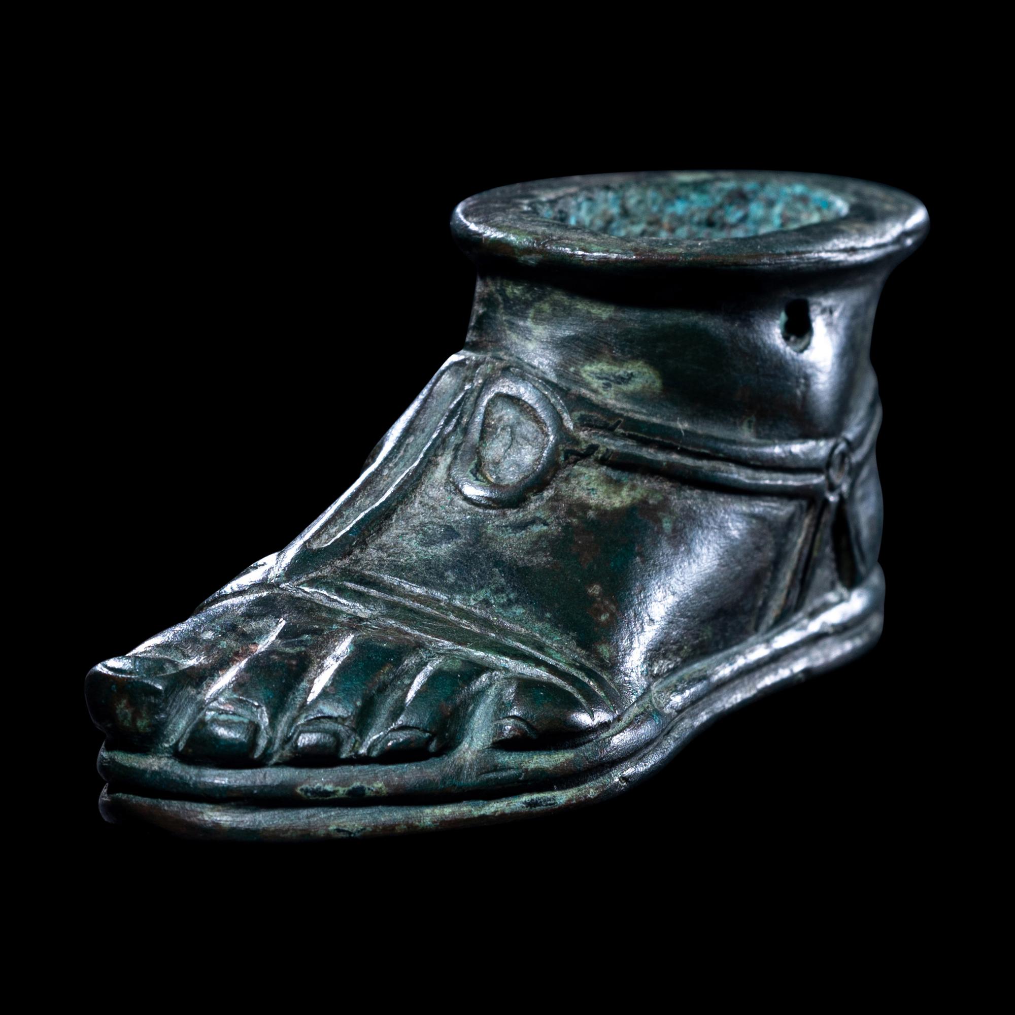 A Roman Bronze Lamp in the form of a Foot