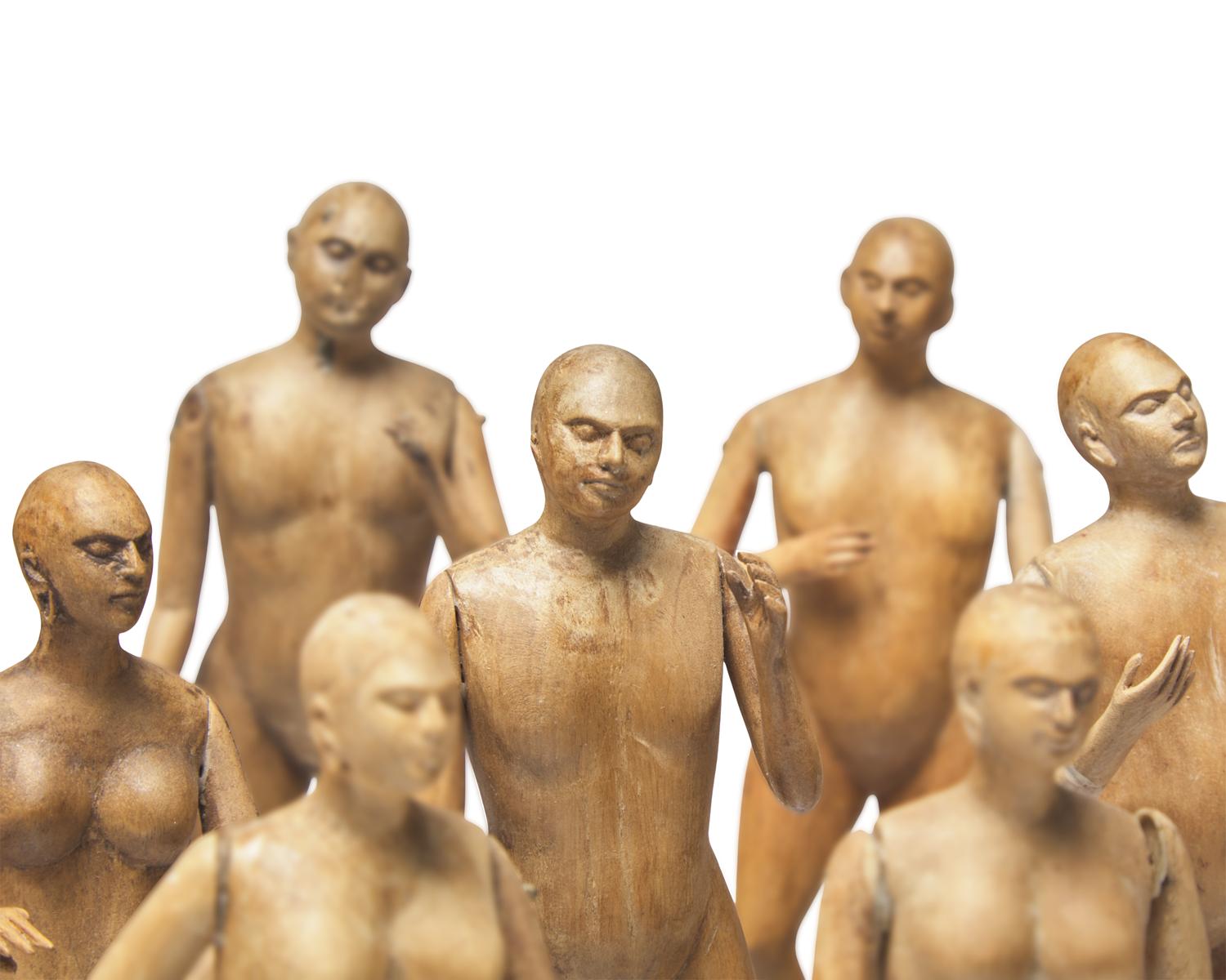 A Group of Fifteen Carved Wood Figures