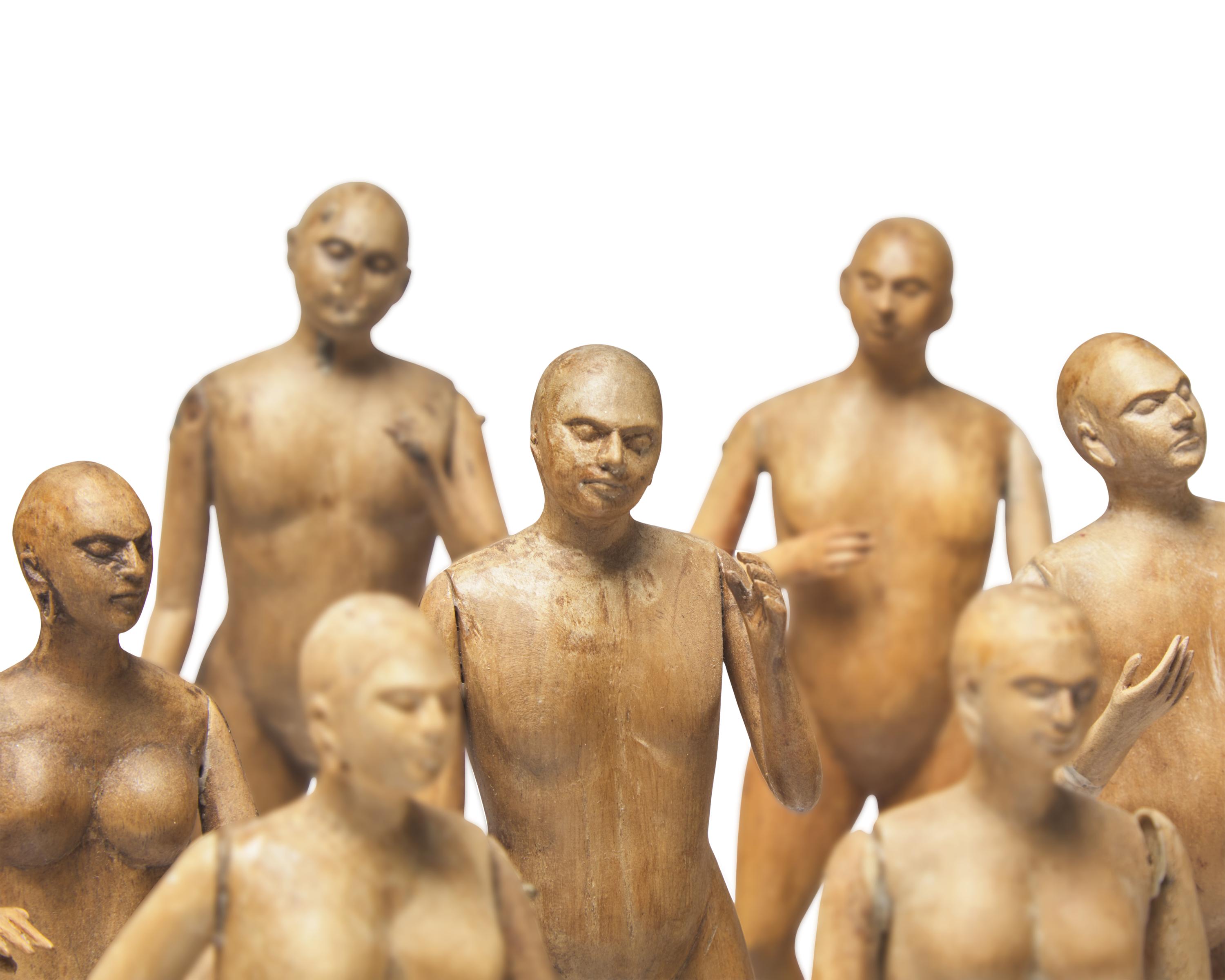 A Group of Fifteen Carved Wood Figures