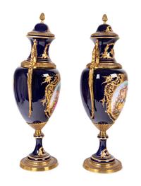 A Pair of Sèvres Style Gilt Metal Mounted Porcelain Urns