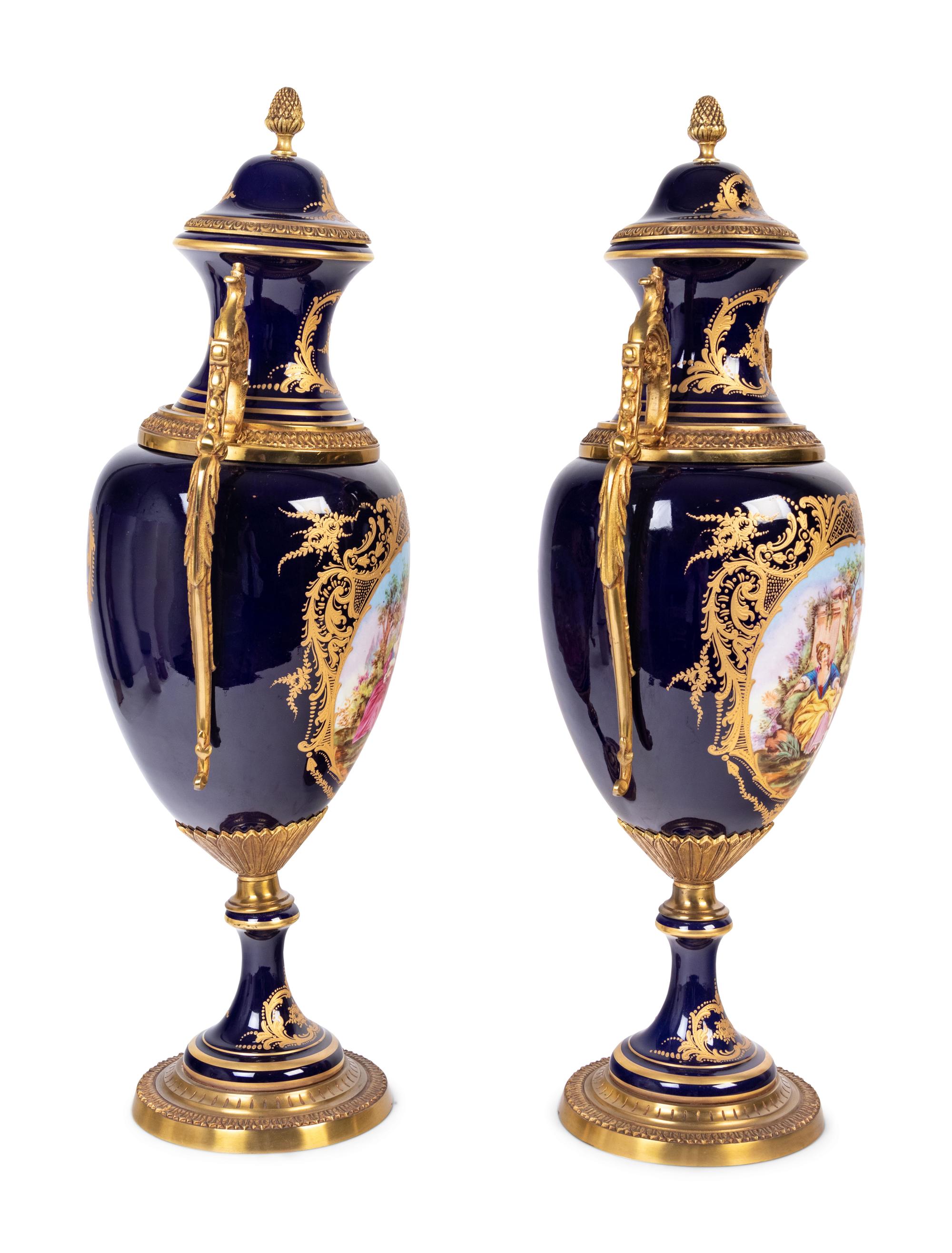 A Pair of Sèvres Style Gilt Metal Mounted Porcelain Urns