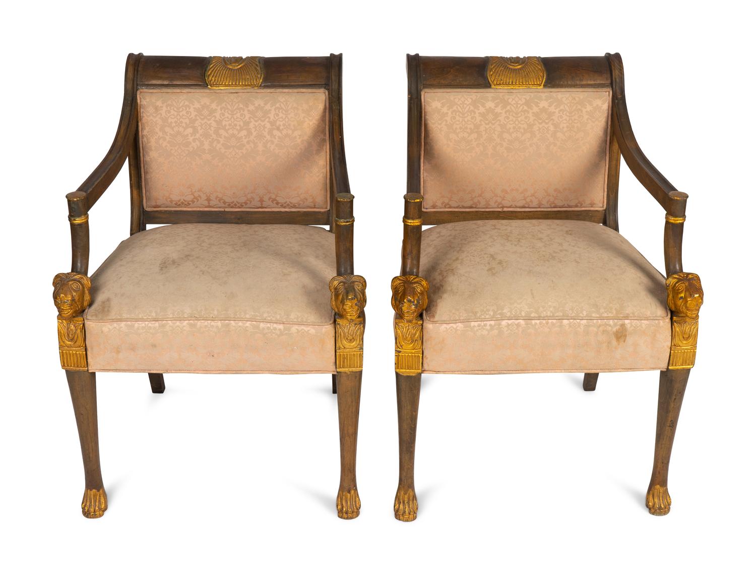 A Pair of Egyptian Revival Parcel-Gilt Mahogany Armchairs — EARLY 20TH CENTURY