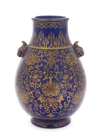 A Gilt Decorated Powder Blue Glazed Porcelain Zun Vase Height 9 3/4 inches. — 20TH CENTURY