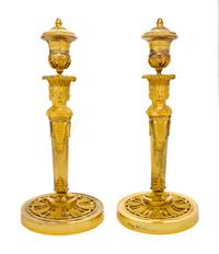 A Pair of Empire Gilt Bronze Candlesticks, EARLY 19TH CENTURY, Height 13 3/4 inches. — EARLY 19TH CENTURY,