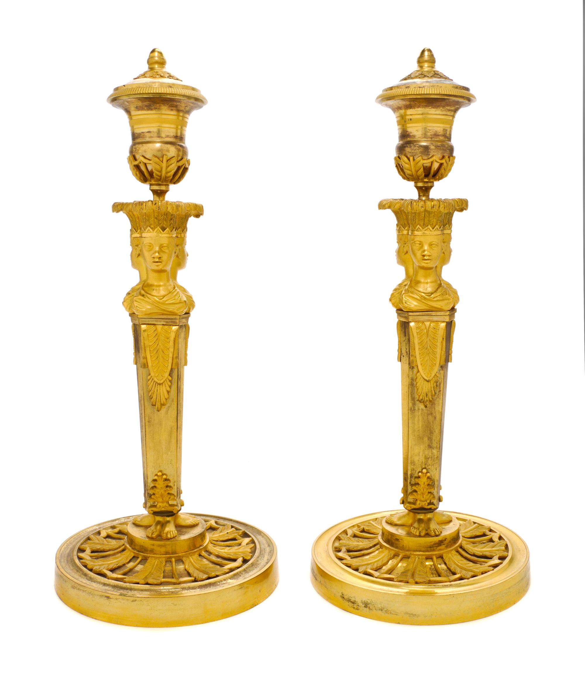 A Pair of Empire Gilt Bronze Candlesticks, EARLY 19TH CENTURY, Height 13 3/4 inches. — EARLY 19TH CENTURY,