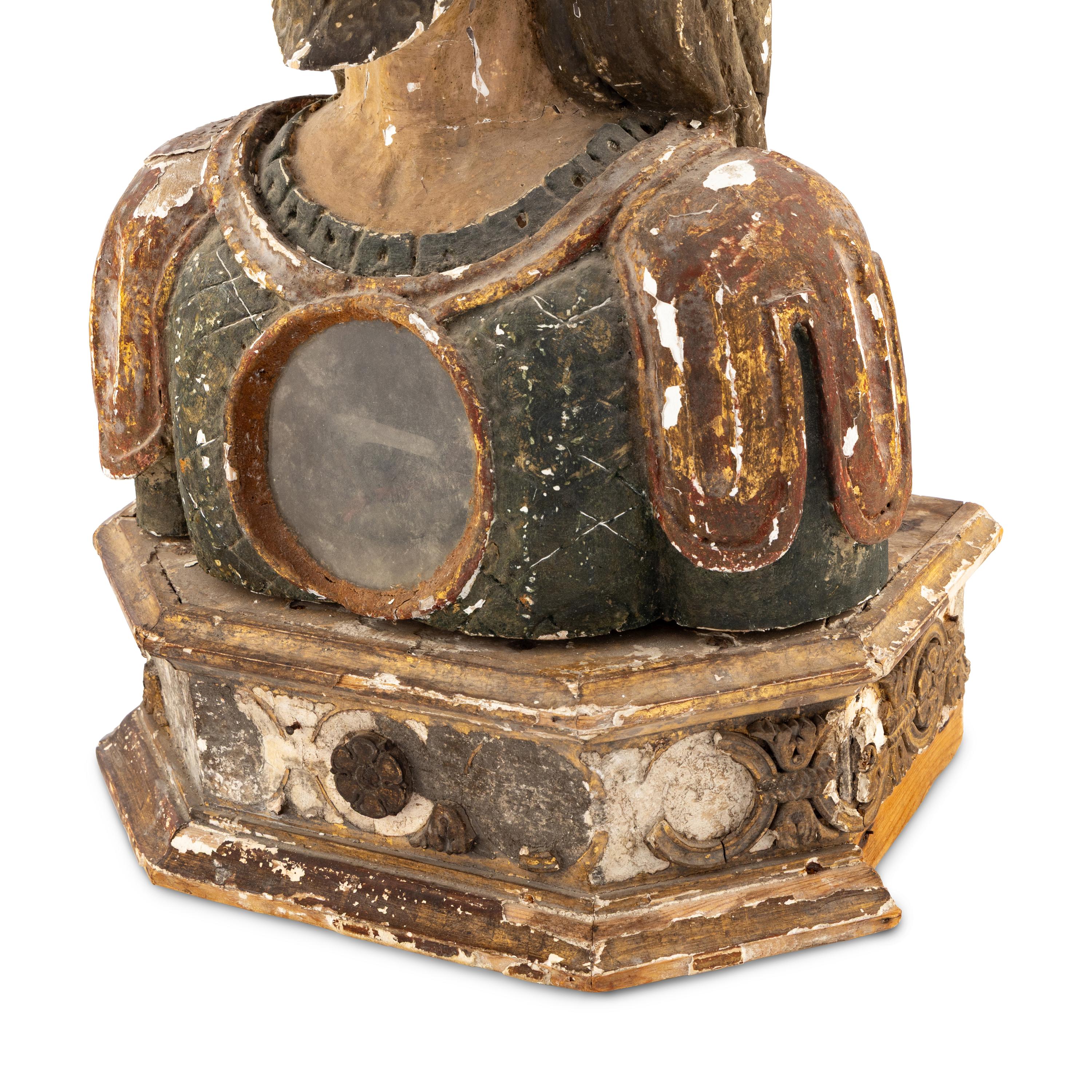 A Spanish Carved Wood and Polychrome Decorated Reliquary Bust
