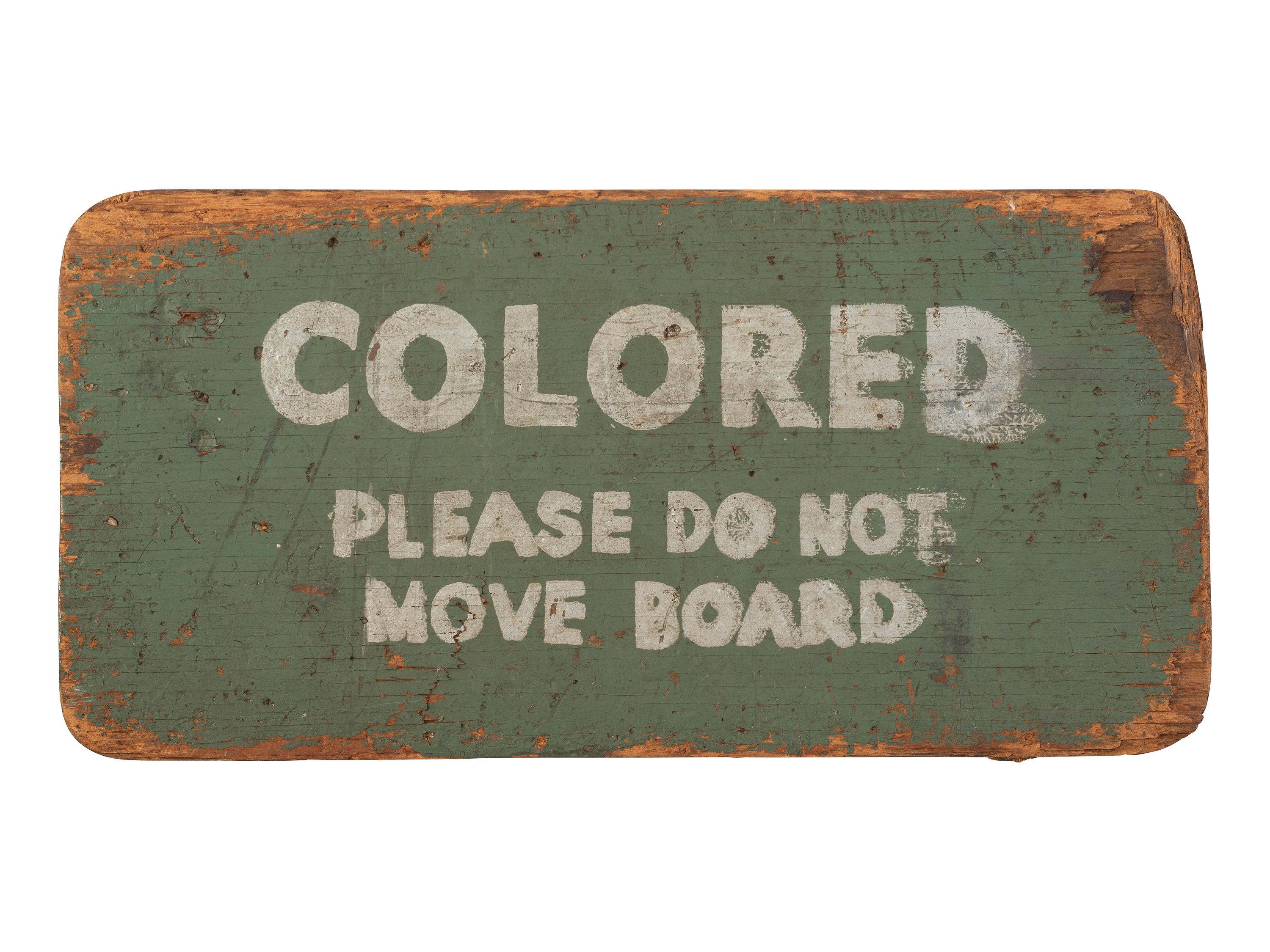 [CIVIL RIGHTS -- SEGREGATION]. Montgomery bus sign, "Colored / Please Do Not Move Board." [Montgomery, AL], [1949].