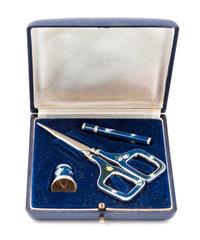 A German Silver and Enamel Three-Piece Sewing Kit, , comprising scissors, a thimble and a needle case, each having a dark blue enamel g