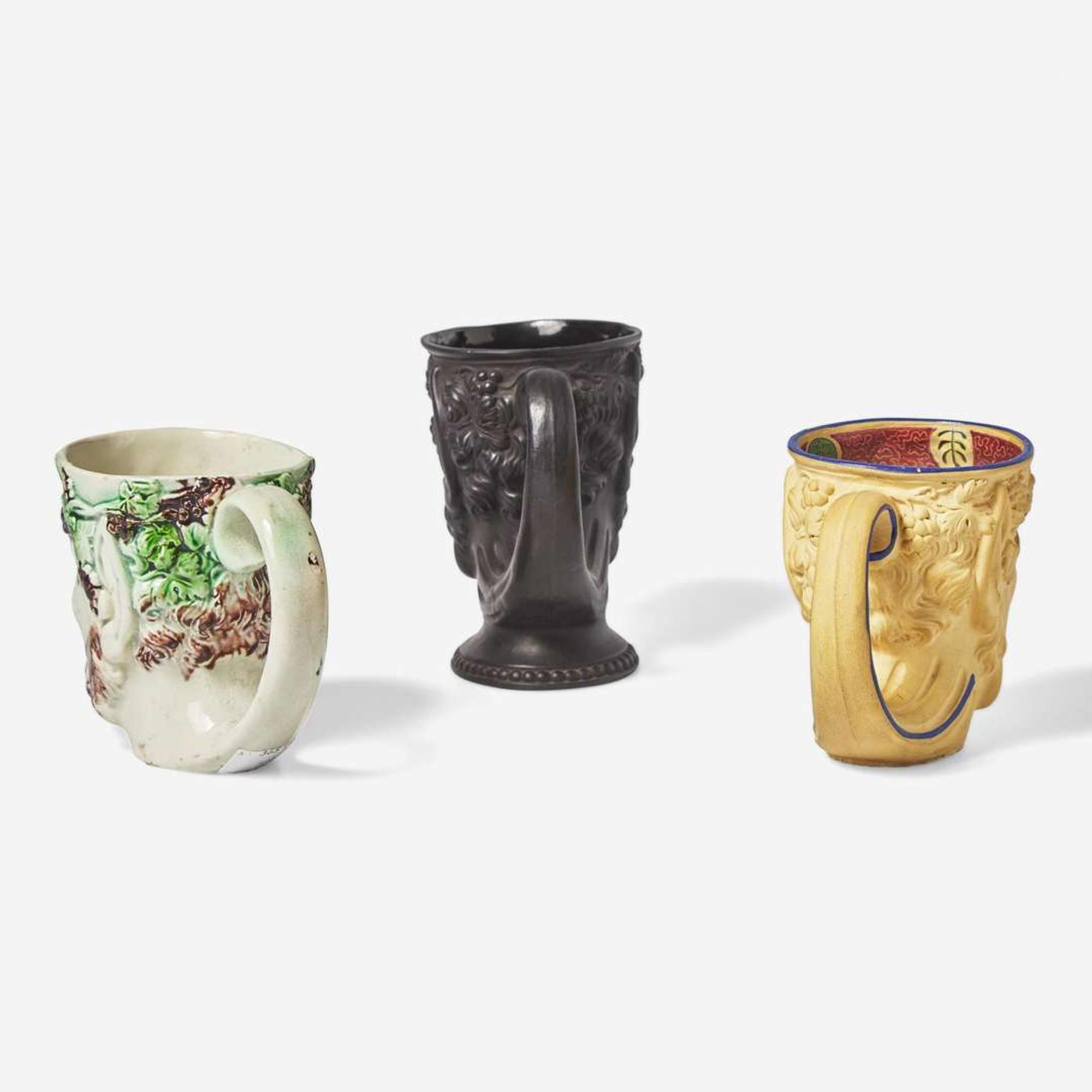 Three Turner Pottery stoneware and glazed earthenware satyr head mugs England, circa 1800