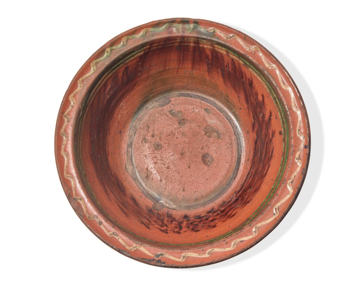 A Glazed and Slip-Decorated Redware Bowl, Maryland or Pennsylvania, Mid-19th Century