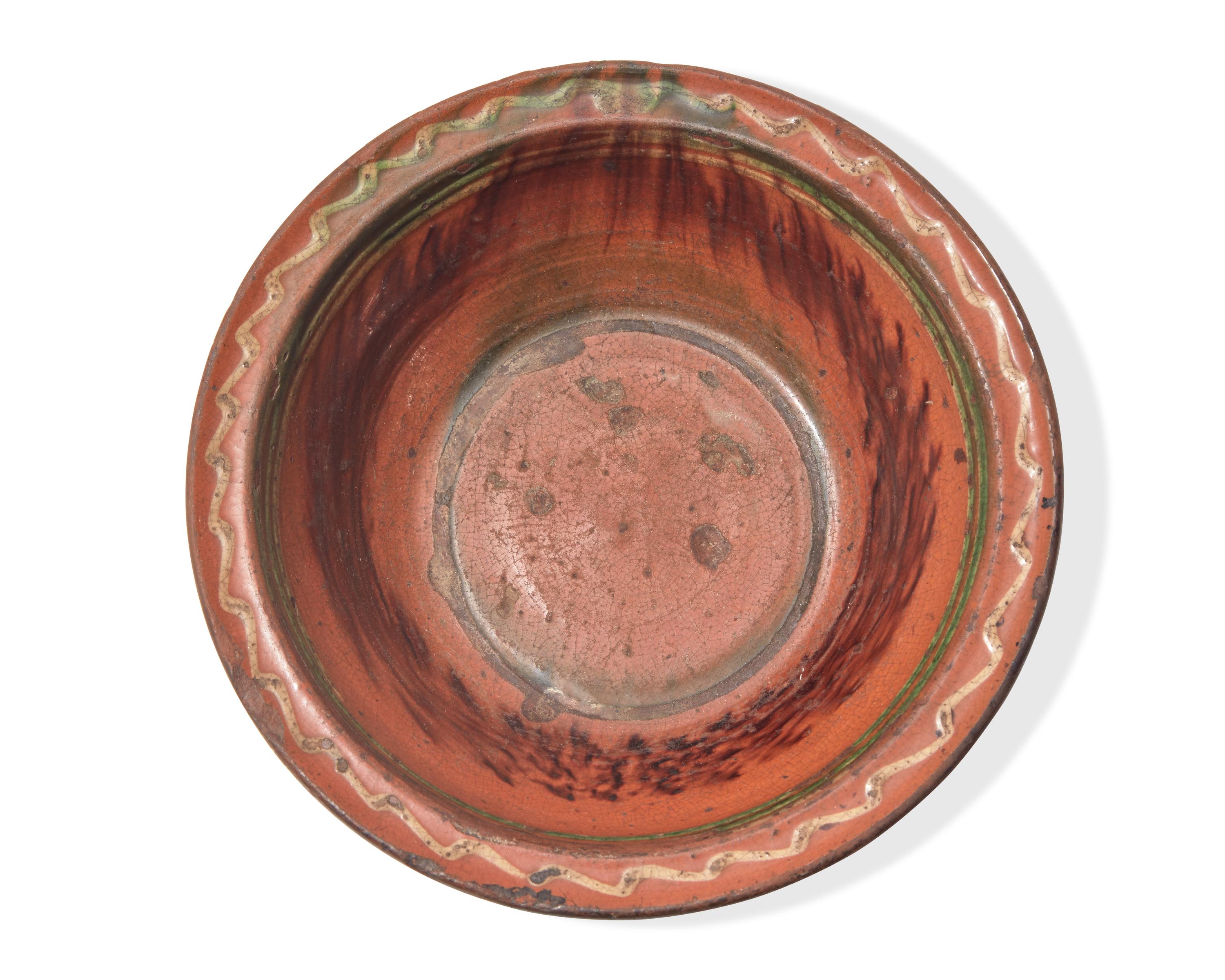 A Glazed and Slip-Decorated Redware Bowl, Maryland or Pennsylvania, Mid-19th Century